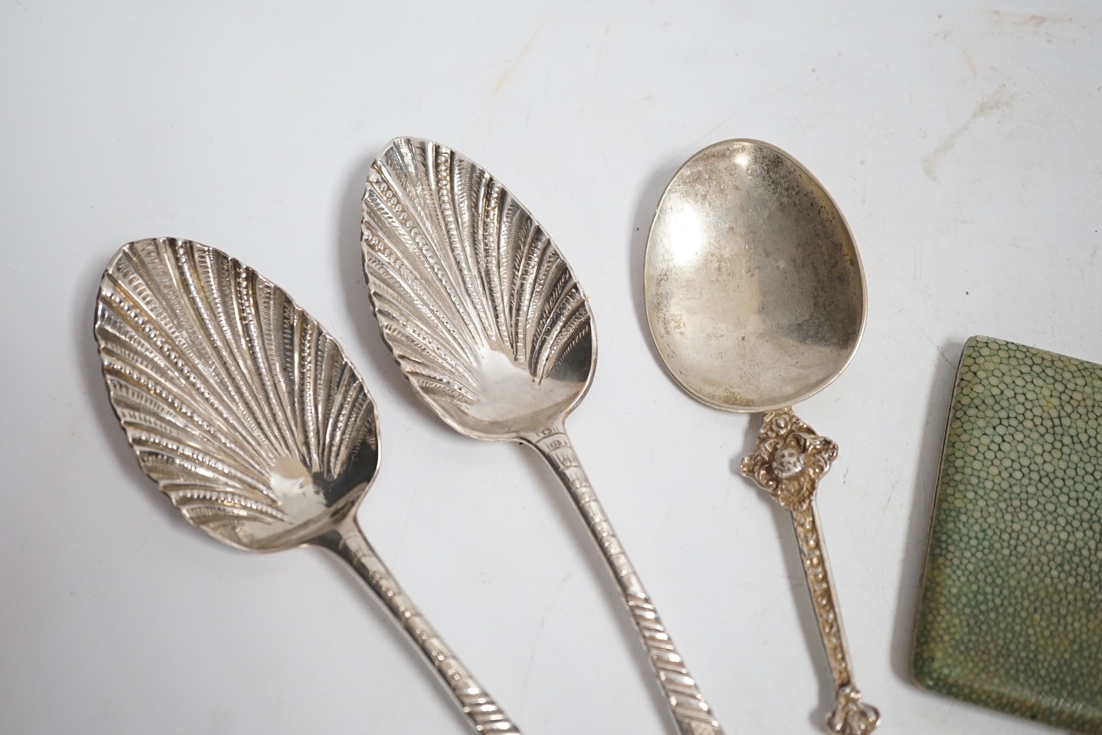 A George III Scottish provincial table spoon, with later decoration, Robert Keay I, Perth, circa 1790, 22.5cm, together with a George III silver table spoon with similar decoration, a continental white metal spoon and a
